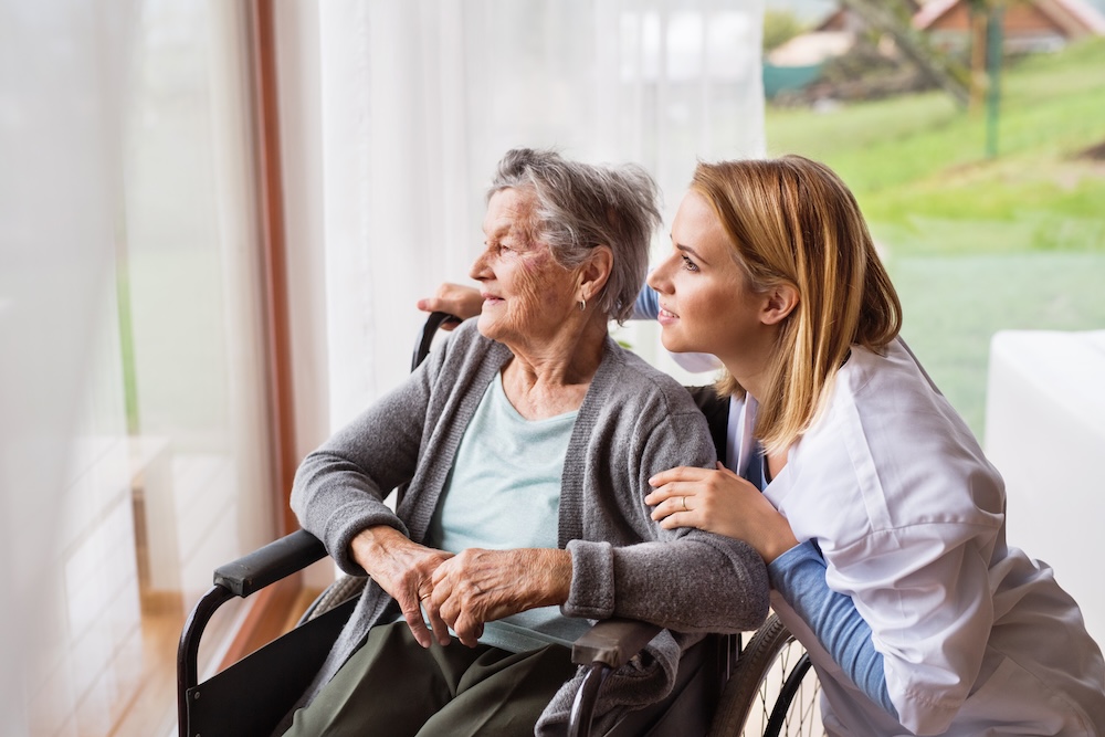 Caregiver assisting a senior with daily living at home in Akron, OH — home health care service